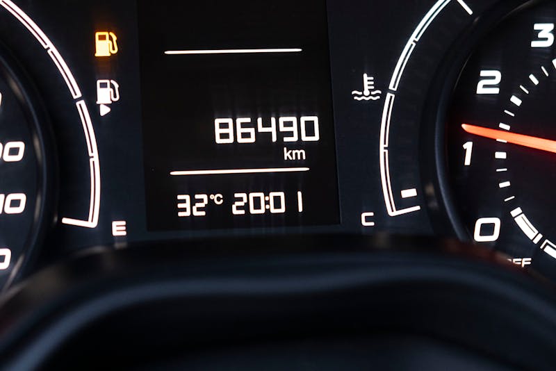 a car's dashboard showing mileage details